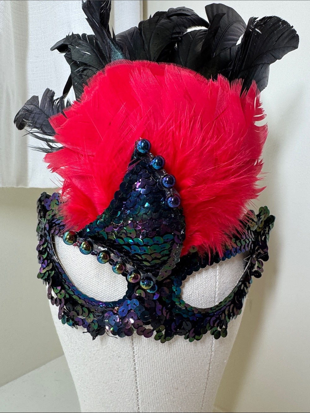 Handmade sequined and feathered mask from New Orleans.